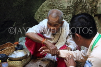 CAMBODIA, Angkor, Preah Khan Temple, monk offering blessing, CAM1200JPL