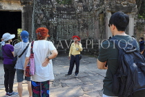CAMBODIA, Angkor, Preah Khan Temple, tourists with guide at temple site, CAM1141JPL