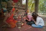 CAMBODIA, Angkor Wat, couple getting blessing from monk, CAM85JPL