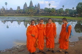 CAMBODIA, Angkor Wat, monks standing in front of temple site, CAM65JPL