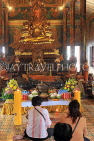 CAMBODIA, Phnom Penh, Wat Phnom, Main Hall, Budda statue and worshippers, CAM1961JPL