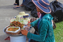 CAMBODIA, Phnom Penh, Water Festival, street food and snacks seller, CAM1884JPL