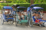 CAMBODIA, Phnom Penh, cyclo drivers sleeping, CAM84JPL