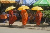 CAMBODIA, Phnom Penh, monks waiting for alms, CAM82JPL