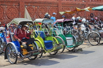 CAMBODIA, Phnom Penh, parked Cyclos, and driver asleep, CAM1701JPL