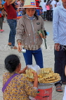 CAMBODIA, Phnom Penh, street food, small stall vendor selling snacks, CAM2082JPL