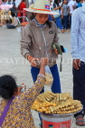 CAMBODIA, Phnom Penh, street food, small stall vendor selling snacks, CAM2083JPL