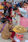 CAMBODIA, Phnom Penh, street food, small stall vendor selling snacks, CAM2084JPL