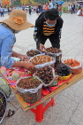 CAMBODIA, Phnom Penh, street food, stall selling fried insects, crickets, grubs, CAM2077JPL