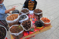 CAMBODIA, Phnom Penh, street food, stall selling fried insects, crickets, grubs, CAM2079JPL