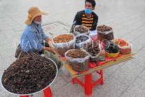 CAMBODIA, Phnom Penh, street food, stall selling fried insects, crickets, grubs, CAM2080JPL