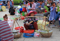 CAMBODIA, Phnom Penh, street food, vendor with food baskets, CAM2095JPL
