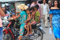 CAMBODIA, Phnom Penh, street scene, biker riding with three kids, CAM1704JPL