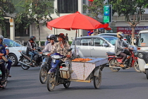 CAMBODIA, Phnom Penh, street scene, mobile street food vendor, in traffic, CAM1773JPL