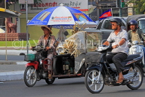 CAMBODIA, Phnom Penh, street scene, mobile street food vendor, in traffic, CAM1774JPL