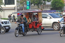 CAMBODIA, Phnom Penh, street scene, traffic, and Tuk Tuk, CAM1819JPL