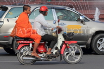 CAMBODIA, Phnom Penh, street scene, traffic, monk getting a bike ride, CAM1829JPL