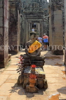 CAMBODIA, Siem Reap, Angkor Thom, Bayon Temple, seated Buddha statue, CAM753JPL