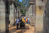 CAMBODIA, Siem Reap, Angkor Thom, Bayon Temple, tourists entering temple site, CAM749JPL