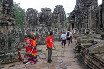 CAMBODIA, Siem Reap, Angkor Thom, Bayon Temple, tourists entering temple site, CAM750JPL