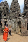 CAMBODIA, Siem Reap, Angkor Thom, Bayon Temple, upper terrace, and monk, CAM822JPL