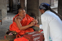 CAMBODIA, Siem Reap, Angkor Wat, Buddhist monk giving blessings, CAM514JPL