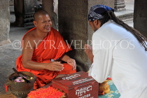 CAMBODIA, Siem Reap, Angkor Wat, Buddhist monk giving blessings, CAM516JPL