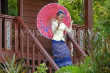 CAMBODIA, Siem Reap, Khmer woman in traditional dress, and umbrella, CAM74JPL