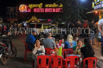 CAMBODIA, Siem Reap, Night Market, street food, people dining, CAM2349JPL