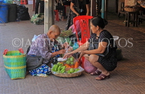 CAMBODIA, Siem Reap, Old Market (Psar Chas), vendor and customer, CAM2377JPL