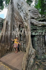 CAMBODIA, Siem Reap, Ta Prohm Temple, Strangler Fig Tree roots engulfing ruins, CAM1496JPL