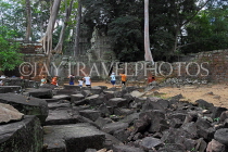 CAMBODIA, Siem Reap, Ta Prohm Temple, ruins at temple site, and tourists, CAM1420JPL