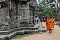 CAMBODIA, Siem Reap, Ta Prohm Temple, temple buildings, and monks, CAM1421JPL