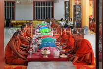CAMBODIA, Siem Reap, Wat Bo Temple, Prayer Hall, Monks at meal time, CAM2069JPL