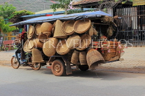 CAMBODIA, Siem Reap, mobile vendor's bike packed with wickerware, CAM2350JPL