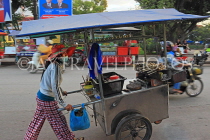 CAMBODIA, Siem Reap, street food, vendor pushing mobile food stall, CAM2339JPL