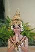 CAMBODIA, Siem Reap, woman posing in traditional dress and headgear, greeting, CAM95JPL