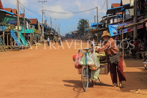 CAMBODIA, Tonle Sap Lake, Kampong Phluk Fishing Village, bicycle vendor, CAM1365JPL