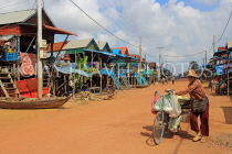 CAMBODIA, Tonle Sap Lake, Kampong Phluk Fishing Village, bicycle vendor, CAM1366JPL