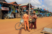 CAMBODIA, Tonle Sap Lake, Kampong Phluk Fishing Village, bicycle vendor, CAM1367JPL