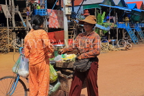 CAMBODIA, Tonle Sap Lake, Kampong Phluk Fishing Village, bicycle vendor, CAM1368JPL