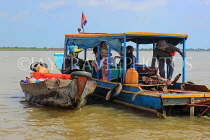 CAMBODIA, Tonle Sap Lake, Kampong Phluk Fishing Village, boat vendor and tour boat, CAM1379JPL