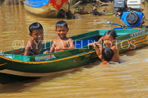 CAMBODIA, Tonle Sap Lake, Kampong Phluk Fishing Village, children playing in lake, CAM1361JPL