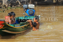 CAMBODIA, Tonle Sap Lake, Kampong Phluk Fishing Village, children playing in lake, CAM1362JPL
