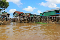 CAMBODIA, Tonle Sap Lake, Kampong Phluk Fishing Village, houses on stilts, CAM1288JPL
