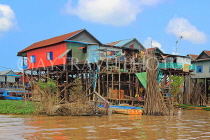 CAMBODIA, Tonle Sap Lake, Kampong Phluk Fishing Village, houses on stilts, CAM1291JPL