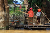 CAMBODIA, Tonle Sap Lake, Kampong Phluk Fishing Village, sorting nets, CAM1371JPL