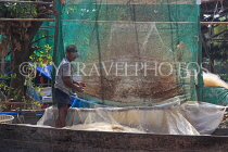 CAMBODIA, Tonle Sap Lake, Kampong Phluk Fishing Village, sorting nets, CAM1374JPL