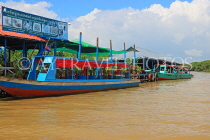 CAMBODIA, Tonle Sap Lake, Kampong Phluk Fishing Village, tour boats by restaurants, CAM1364JPL