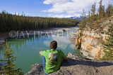 CANADA, Alberta, Jasper National Park, hiker looking at Athabasca river, CAN743JPL